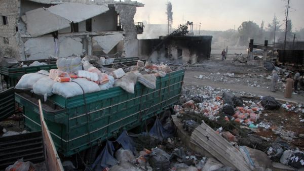 Aid is seen strewn across the floor in the town of Orum al-Kubra on the western outskirts of the northern Syrian city of Aleppo on September 20, 2016, the morning after a convoy delivering aid was hit by a deadly air strike. (AFP/Omar Haj Kadour)