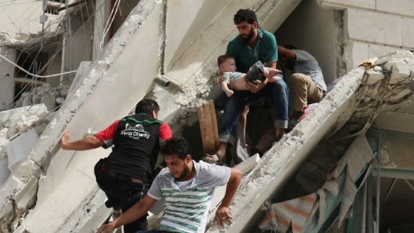 Syrian men remove a baby from the rubble of a destroyed building following a reported air strike in the Qatarji neighborhood of the northern city of Aleppo on September 21, 2016. (AFP/Ameer Alhalbi) Syrian men remove a baby from the rubble of a destroyed building following a reported air strike in the Qatarji neighborhood of the northern city of Aleppo on September 21, 2016. (AFP/Ameer Alhalbi)