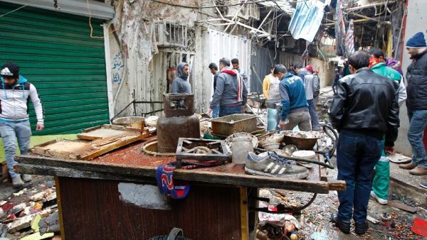 Two suicide bombers attacked Baghdad's central Al-Sinek neighbourhood killing at least 27 people and wounding 53. (AFP/SABAH ARAR)

