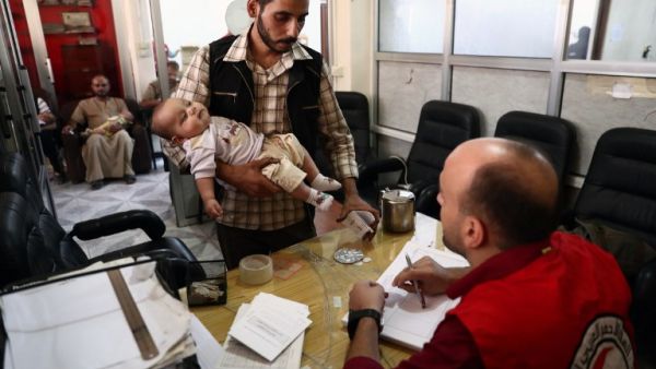 A man registers for vaccine during a vaccination campaign carried out by the Syrian Arab Red Crescent, on September 19, 2016, in the rebel-held town of Douma, on the eastern edges of the capital Damascus. (AFP/Abd Doumany)