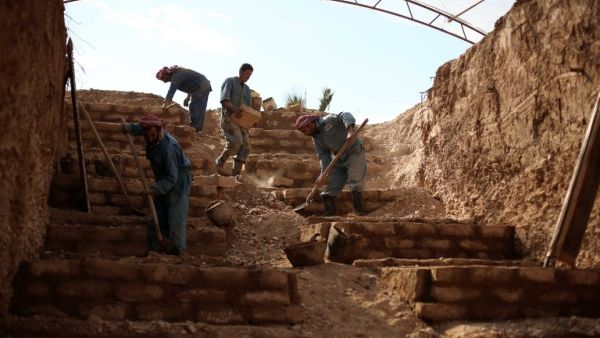 This file photo taken on November 9, 2015 shows workers constructing a layered cemetery in the rebel-held town of Douma, east of the Syrian capital Damascus to make space for the burial of the increasing number of casualties due to airstrikes by the Syrian regime. (AFP/Amer Almohibany)