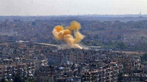 Smoke rises from reported opposition fire from buildings in an eastern government-held neighbourhood of the northern Syrian city of Aleppo on October 20, 2016 as clashes erupted in an area designated as a humanitarian corridor for civilians to leave the embattles city, an AFP journalist said, despite an announced pause in the Syrian army's Russian-backed offensive. (AFP/George Ourfalian)
