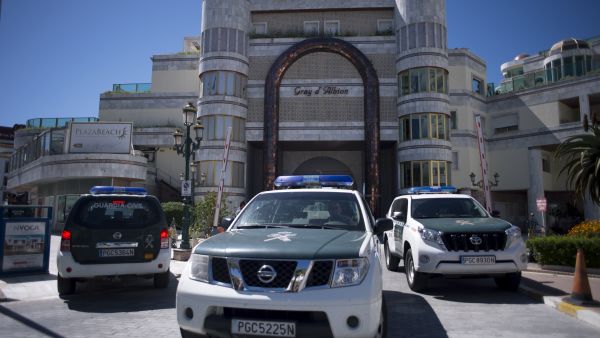 Spanish police vehicles outside one of the properties seized from the uncle of Syrian President Bashar al-Assad. 