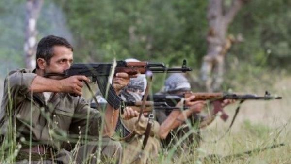 PKK fighters take position with their rife during a traning session. (AFP)
