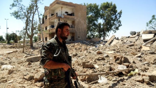 An SDF fighter in war-torn Raqqa, July 2017 (AFP)