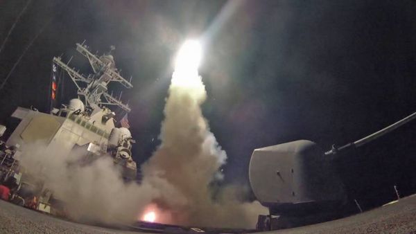 The guided-missile destroyer USS Porter conducts a strike against a Syrian airfield from the Mediterranean Sea on Friday. | AFP