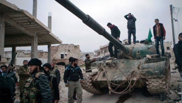 A file photo of Syrian rebels gather around a T-72 tank, captured from government forces. (AFP) A file photo of Syrian rebels gather around a T-72 tank, captured from government forces. (AFP)