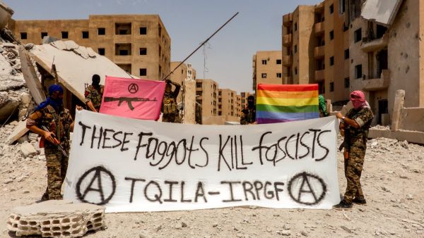 "These Faggots Kill Fascists! We shoot back! The Black & Pink and Rainbow flag fly in Raqqa. #Queers smashing the Caliphate" this photo was captioned on Twitter (IRPGF) "These Faggots Kill Fascists! We shoot back! The Black & Pink and Rainbow flag fly in Raqqa. #Queers smashing the Caliphate" this photo was captioned on Twitter (IRPGF)