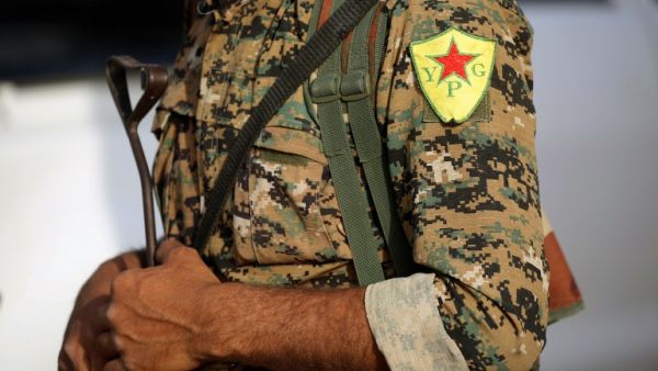 A Kurdish YPG fighter in Karamah outside Raqqa (Delil Souleiman/AFP)
