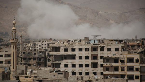 A picture shows smoke billowing following reported air strikes on rebel positions in the opposition-controlled district of Qaboun on the outskirts of the Syrian capital Damascus in the Eastern Ghouta region on April 27, 2017. (AFP/Ammar Suleiman)