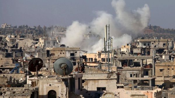 Smoke billows following reported shelling by Syrian government forces in the rebel-held area of Deraa, in southern Syria, on January 18, 2017. (AFP/Mohamad Abazeed)