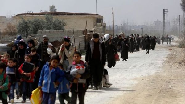 Fleeing refugees from Eastern Ghouta. At least 130,000 have left the suburb as regime forces spread their control on the area, (AFP/ File Photo)