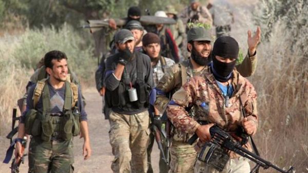 Rebels move through Idlib. (AFP/Omar Haj Kadour) Rebels move through Idlib. (AFP/Omar Haj Kadour)