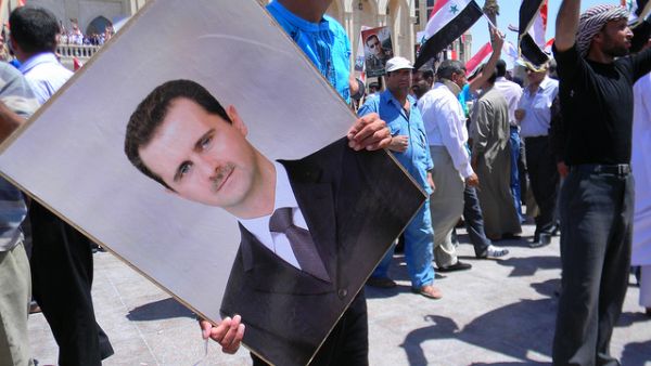 Supporters of Assad gather in 2010 (Flickr, image used for illustrative purposes only)