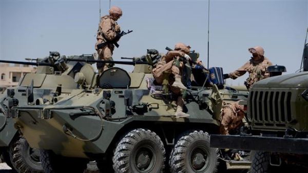 Russian army soldiers are seen with their vehicles at their military camp, known as the International Demining Center, in the ancient Syrian city of Palmyra . (AFP/ File Photo)