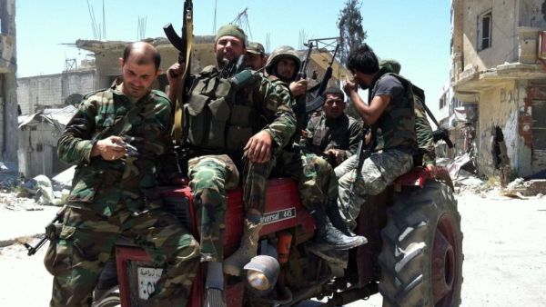 The signs of crumbling manpower weren't as loud as Assad's speech in Damascus, but they were there. (AFP/File)