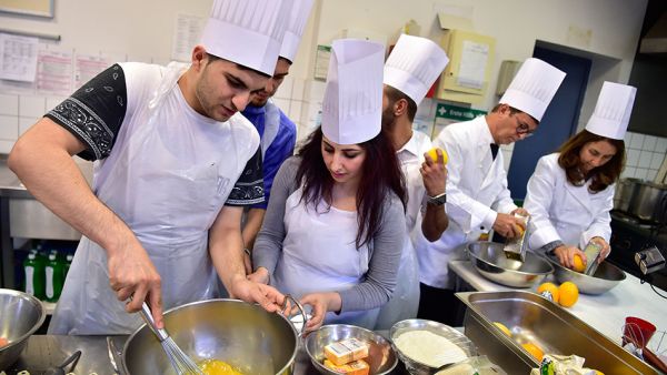 Syrian refugees in Germany prepare Iftar together (AFP)