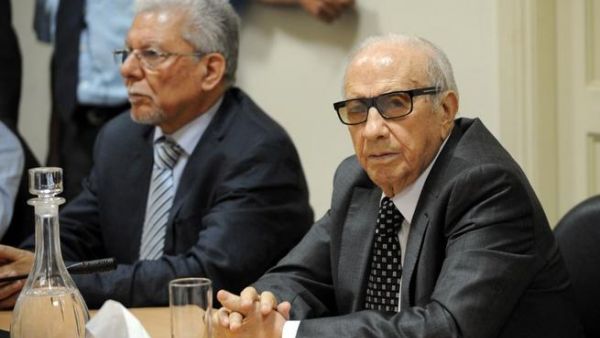 Tunisian mediator and Secretary General of the Tunisian General Labour Union (UGTT) Houcine Abbassi speaks during a meeting as part of the dialogue between ruling Islamists and the opposition. [AFP]