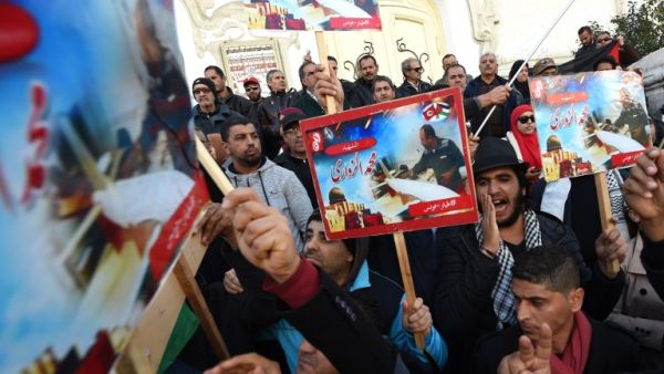 Tunisians protest against Israel on Tuesday (Fethi Belaid/AFP)