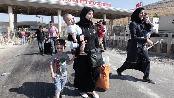 Syrian refugees are seen crossing the border into Turkey. (AFP/File)
