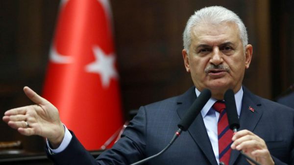 Turkish Prime Minister and leader of Turkey's ruling Justice and Development Party (AKP) Binali Yildirim addresses the AKP group meeting at the Grand National Assembly of Turkey in Ankara on November 29, 2016. (AFP/Adem Altan)