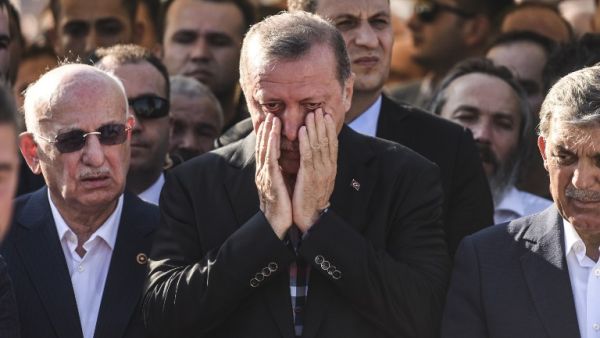 Turkey's President Recep Tayyip Erdogan reacts after attending the funeral of a victim of the coup attempt in Istanbul on July 17, 2016. (AFP/Bulent Kilic)