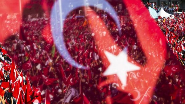 People wave Turkish flags during a rally organized by the main opposition group, the secular and centre-left Republican People's Party (CHP), on July 24, 2016 in Istanbul's Taksim square. (AFP/Gurcan Ozturk)