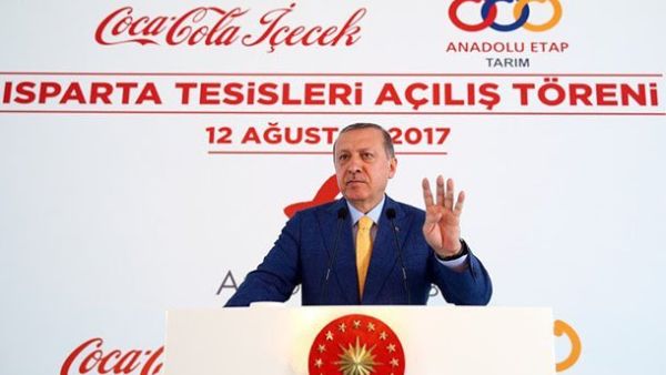 This image of Erdogan make the Rabaa sign while opening the Coca-Cola factory on Saturday was widely circulated on social media (Twitter)