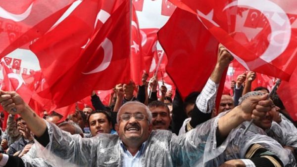 Supporters cheer Turkey's President Recep Tayyip Erdogan as he addresses an election rally in Golbasi. (AFP Photo)