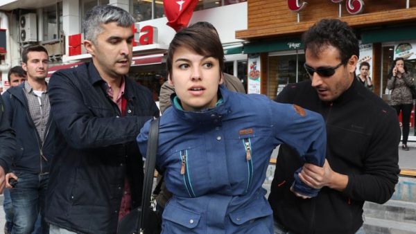 Turkish riot police detain a protester during a demonstration against the arrest by Turkish authorities of an academic and a teacher who have been on a hunger strike, in Ankara, on May 23, 2017. (AFP/Adem Altan)
