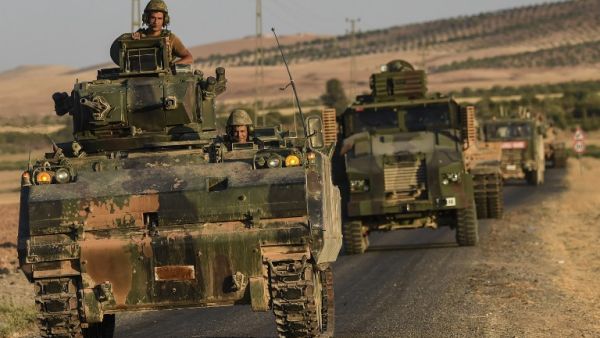 This file photo taken on September 02, 2016 shows Turkish soldiers driving back to Turkey from the Syrian-Turkish border town of Jarabulus. (AFP/Bulent Kilic)