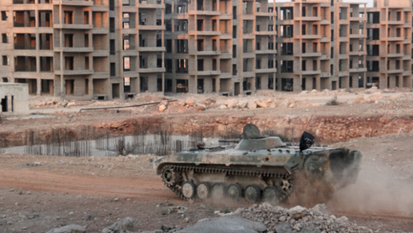 Opposition fighters drive tank in eastern government-besieged neighbourhood of Aleppo. (AFP/File)