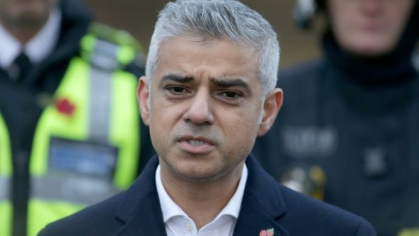 This file photo taken on November 09, 2016 shows Mayor of London Sadiq Khan (C) addresses the media as he stands with members of the emergency services during his visit to the scene of a derailed tram, in Croydon, south London, on November 9, 2016. (AFP/Daniel Leal-Olivas)