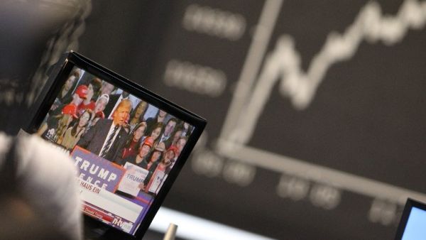 On the currency markets, the dollar tumbled about 2 per cent against major global currencies as Trump supporters celebrated his victory over Democrat candidate Hillary Clinton. (AFP/Daniel Rowland)