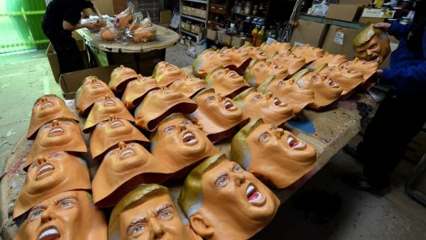 Employees producing rubber masks of US President-elect Donald Trump at the Ogawa Studios mask factory in Saitama, north of Tokyo. (AFP/Toshifumi Kitamura)