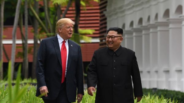 US President Donald Trump (L) and North Korea's leader Kim Jong Un (R) during Singapore Summit on on June 12, 2018. (AFP/ File)