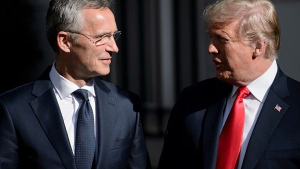 NATO Secretary General Jens Stoltenberg (L) stands next to US President Donald Trump ahead of a NATO Summit in Brussels on July 11, 2018. (Brendan Smialowski/ AFP)