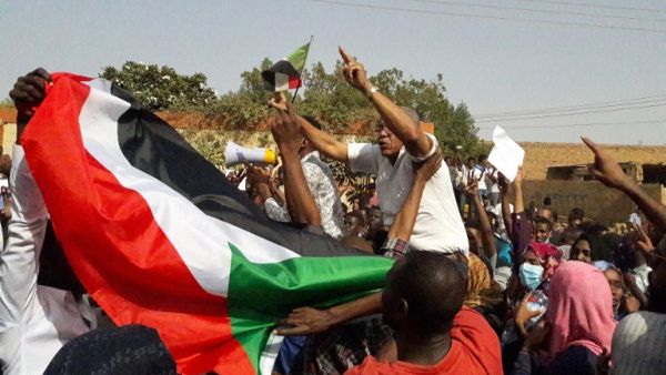 Sudanese protesters wave their national flag and chant slogans during an anti-government demonstration in the capital Khartoum's twin city of Omdurman on January 31, 2019. (AFP)