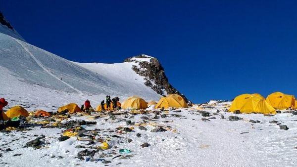 Discarded climbing equipment and rubbish is scattered around Camp four of Mount Everest, where decades of commercial mountaineering have left a trail of discarded waste. (AFP/ File Photo)