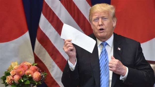 US President Donald Trump shows a letter he said he received the previous day from North Korean leader Kim Jong-un, on September 26, 2018. (AFP/File) US President Donald Trump shows a letter he said he received the previous day from North Korean leader Kim Jong-un, on September 26, 2018. (AFP/File)