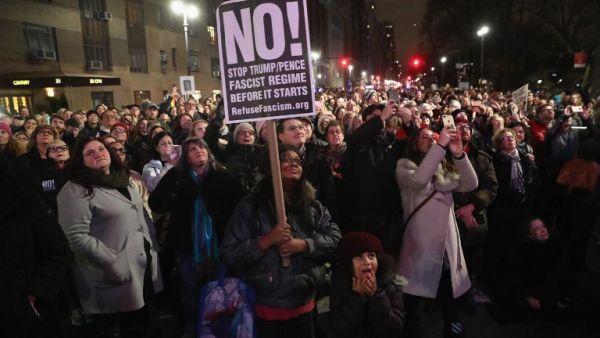 People gather outside the Trump International Hotel in Manhattan to protest against Donald Trump on January 19, 2017 in New York City. Trump will be inaugurated January 20th as the 45th President of the United States. (AFP/John Moore)