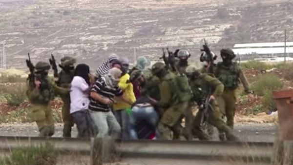 The undercover Israeli agent reportedly detained three injured Palestinians during the clashes. (AFP/File)
