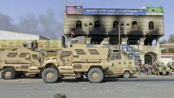 An armoured vehicles for Yemeni forces are seen in the outskirts of Al-Hudaydah on 8 November. (AFP/File) 