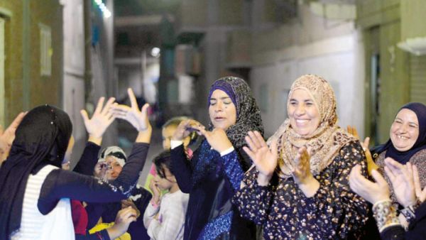 Although Egyptian women play great roles on social occasions as weddings, they are increasing turning their hands to political life  (AFP/File Photo)	