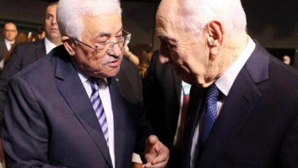 Mahmoud Abbas and the late Shimon Peres (AFP/File)
