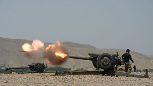 An Afghan National Army soldier fires at Daesh militants in Kot, in the eastern Nangarhar province on June 26, 2016. (AFP/Noorullah Shirzada)