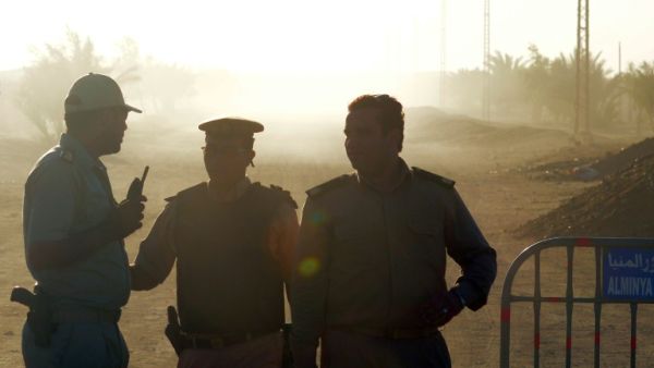 Egyptian policemen guard the road to Saint Samuel monastery in Minya province after the attack on a bus carrying Coptic Christians. (AFP/File)