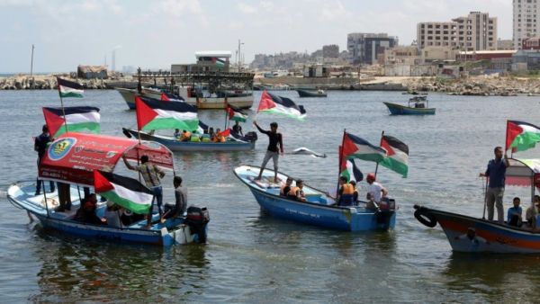 Palestinians in Gaza rally on boats in support of a freedom flotilla. (AFP/File)