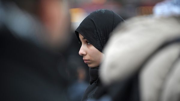 "Some of my close friends have had to choose between taking off their hijabs and feeling safe or keeping them on and becoming a target of bigotry," writes Hiba Ibrahim.  (AFP/Bertrand Langlois)