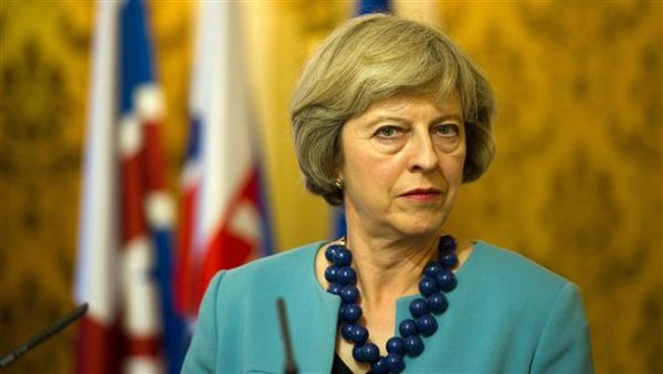 PM Theresa May announces UK will 'stop all defense engagement and training of Burmese military' (AFP/File)